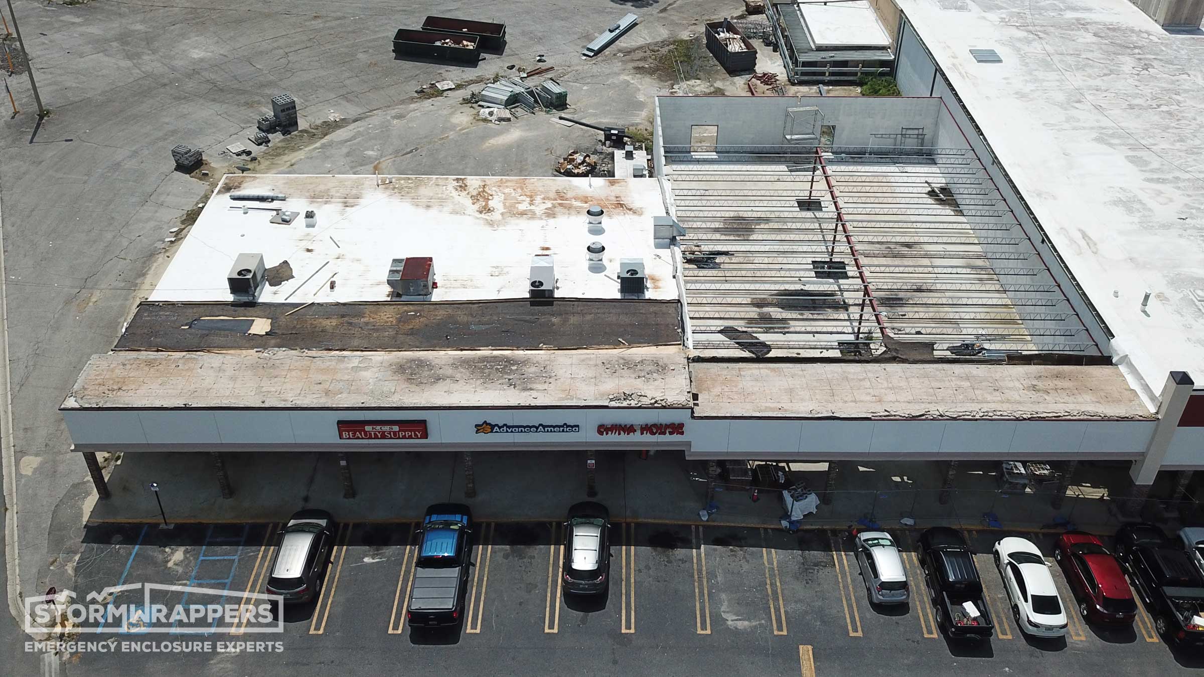 # How StormWrappers Bolsters Servpro's Big Project Capacity ## The Immediate Aftermath of Hurricane Idalia In the wake of Hurricane Idalia, the devastation left behind posed a monumental challenge for disaster recovery efforts. A prime example of the havoc wreaked by such natural disasters was the severe damage inflicted on a strip mall's TPO roof in Madison, FL. The hurricane's fierce winds tore off the front half of the TPO membrane, flipping it back over itself, leaving the property vulnerable to further damage and exposing the limitations of traditional disaster response capabilities. ## StormWrapper's Rapid Response Responding within just 24 hours under a Master Service Agreement (MSA), StormWrapper's intervention was nothing short of a game changer. Their swift action to demo off storm debris and temporarily resecure the existing TPO membrane was crucial in preventing further damage. This rapid response not only showcased StormWrapper’s commitment but also highlighted the enhanced capabilities they bring to partnerships with franchises like Servpro. Such quick and efficient emergency enclosure services are indispensable in the immediate aftermath of a disaster, underscoring the value of preparedness and the right partnerships. ## Analyzing the Damage The damage assessment conducted by StormWrapper went beyond mere repair work; it provided a comprehensive roofing report that pinpointed the root cause of the roof membrane failure to be the use of improper fastener length by the original contractor. This level of expertise underlines the importance of thorough evaluations in disaster recovery efforts, ensuring that repairs are not just quick fixes but are solutions that address the core issues, preventing potential future failures. ## Servpro and StormWrapper: Synergies in Disaster Recovery The collaboration between Servpro and StormWrapper in the aftermath of Hurricane Idalia exemplifies the synergies that can be achieved in disaster recovery. Servpro’s national reputation for restoration and cleanup, combined with StormWrapper's specialized emergency enclosure capabilities, creates a powerful alliance. This partnership enables Servpro franchises to significantly enhance their service offerings, particularly for large-scale projects that demand rapid response and specialized expertise. Such collaborations not only augment the capabilities of each entity but also ensure that affected businesses and communities receive the most comprehensive and effective recovery services possible. ## The Impact of Proper Installation The TPO roof incident in Madison, FL, serves as a poignant lesson on the importance of proper installation and the potential consequences of oversight. StormWrapper's detailed analysis and documentation of the incident underscore the critical need for adherence to best practices in construction and disaster recovery efforts. This episode highlights the value that expert partners like StormWrapper bring to the table, not just in terms of emergency response but also in ensuring that recovery work is grounded in quality and sustainability. ## The Future of Disaster Recovery Partnerships The successful partnership between Servpro and StormWrapper in responding to the destruction caused by Hurricane Idalia points towards a promising future for disaster recovery efforts. As climate change continues to increase the frequency and severity of natural disasters, the demand for swift, effective, and expert-driven recovery services will only grow. Partnerships like that of Servpro and StormWrapper are paving the way for a new standard in disaster recovery, where the emphasis is on rapid response, expertise, and the ability to handle large-scale projects efficiently. The future of disaster recovery lies in leveraging such synergies, ensuring that when the next disaster strikes, the response is stronger, smarter, and swifter. How StormWrappers Bolsters Servpro's Big Project Capacity